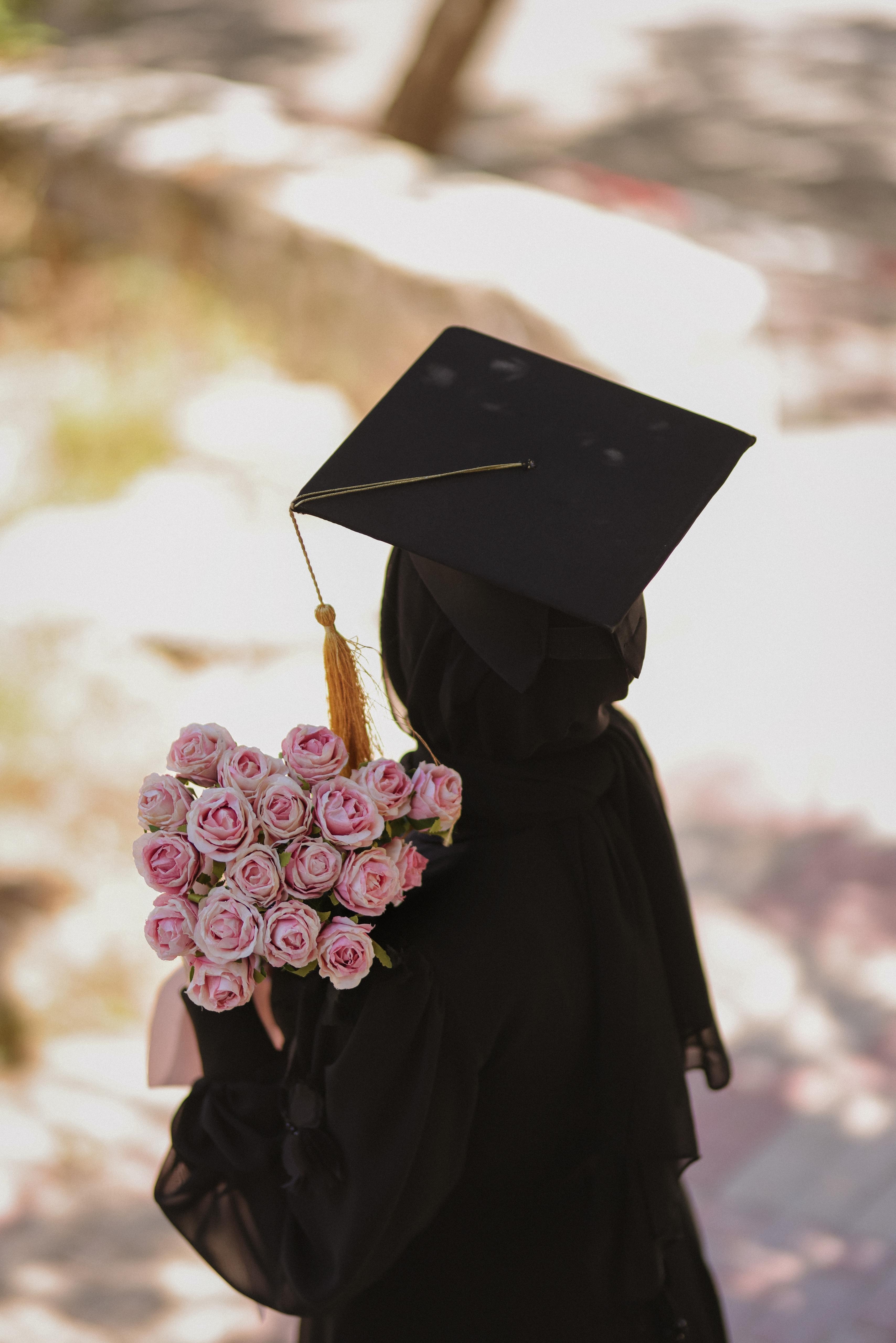 ["person","roses","bouquet","graduation"]